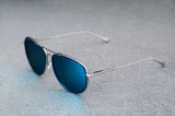 Silver aviator style sunglasses with reflective blue lenses, open, facing left showing a quartering view.