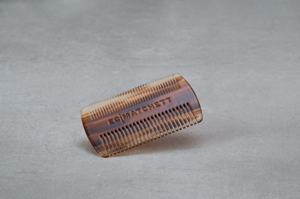 4 inch beard comb made of red-brown Italian acetate.