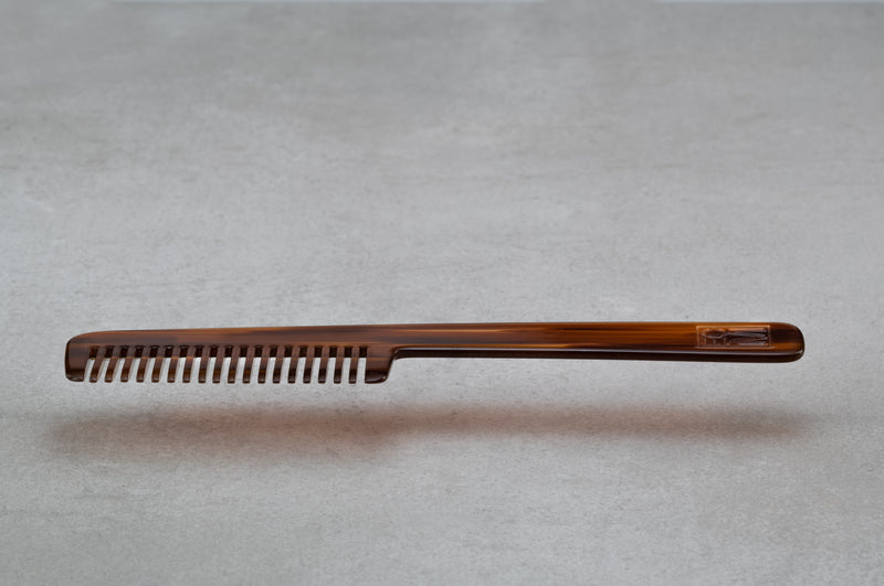 8.5 inch (4.5 inch handle) comb made of red-brown Italian acetate.