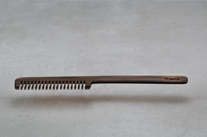 8.5 inch (4.5 inch handle) comb made of brown Italian acetate.
