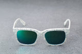 White patterned sunglasses with reflective blue lenses, facing forward with temples open..