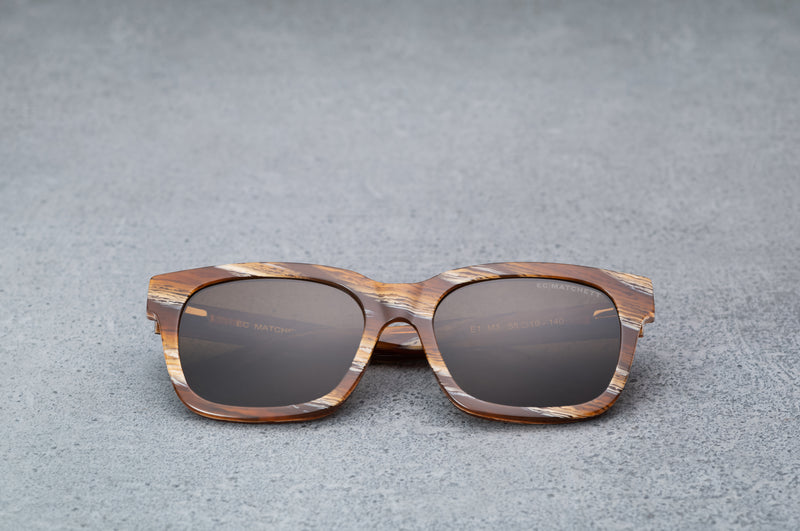 Brown and white patterned sunglasses, facing forward.